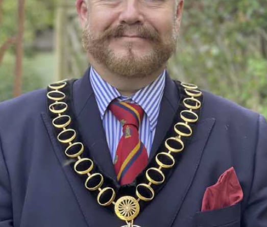 Whitehill & Bordon councillor Adam Carew wearing the chain of the chairman of East Hampshire District Council