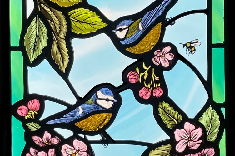 Artist Jessica Stroud’s stained glass work Blue Tits in the Apple Tree