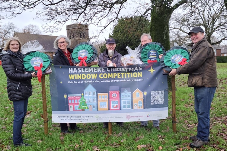 The four Christmas windows competition judges with Rev Justin Manley-Cooper (centre)