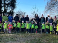 Young and old plant trees in Shalden to remember the Queen