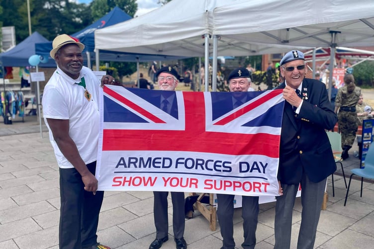 Whitehill town mayor Cllr Leeroy Scott and veterans with the Armed Forces Day flag, Café 1759, Bordon, June 24th 2023.