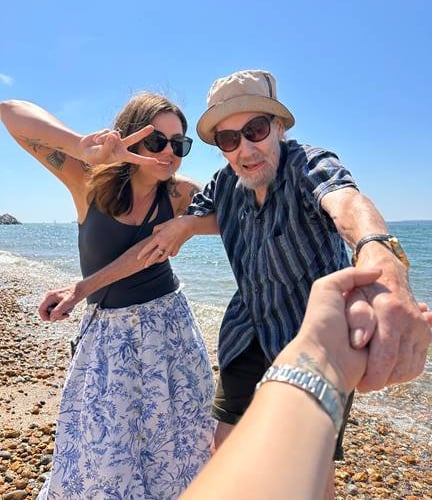 Resident Peter and Activities Coordinator Kata Beauchemin have fun on the shore