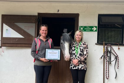 Treloar's presents certificate to Broadlands Riding for the Disabled
