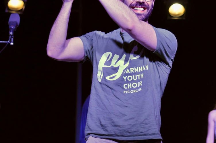 Farnham Youth Choir conductor Patrick Barrett celebrates the choir's win in Provence