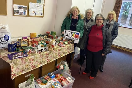 Exercise group makes (keep) fitting donation to Liss Food Bank