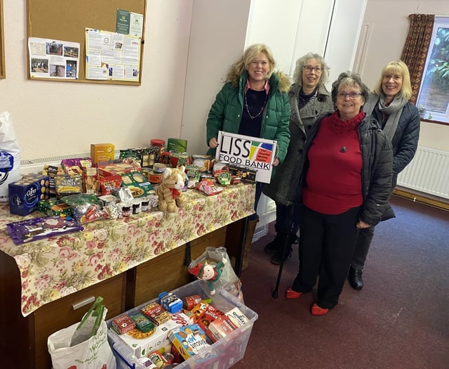 Exercise group makes (keep) fitting donation to Liss Food Bank