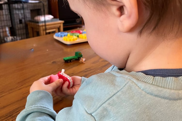 Noah playing with his toys.