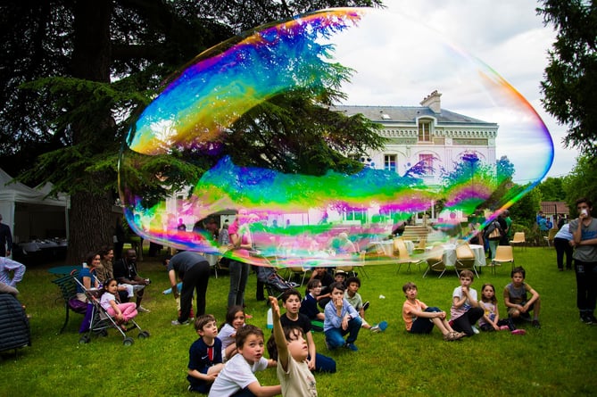 Performing for children outside the Brunoy Museum in France