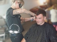 Blindfolded barbers cut hair for mental health charity