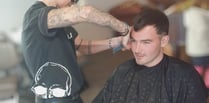 Blindfolded barbers cut hair for mental health charity