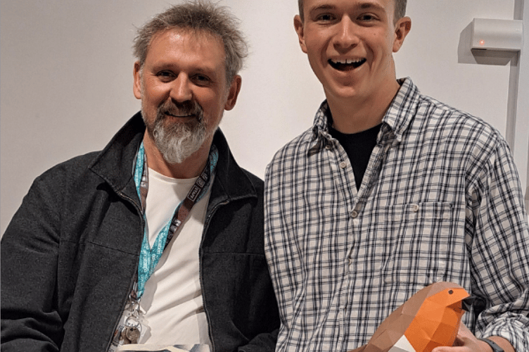 Nathan Ward, right, with Alton College art lecturer Mark Taylor. Mark is holding Paper Boat by Margaret Atwood, a poetry anthology for which Nathan designed the cover, January 2025.