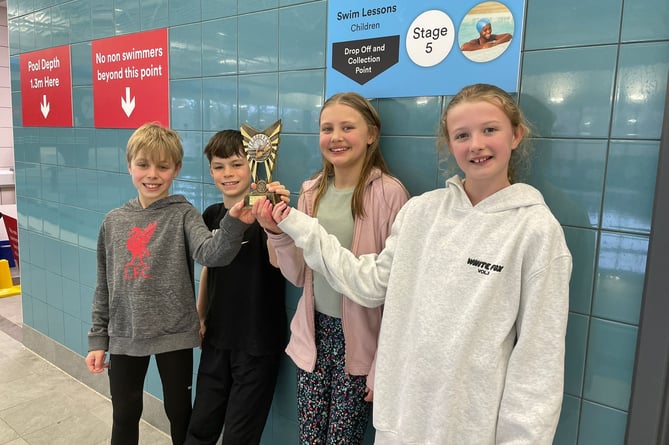 Children from The Butts Primary School with the larger schools division trophy, Alton primary schools swimming gala, Alton Sports Centre, January 16th 2025.