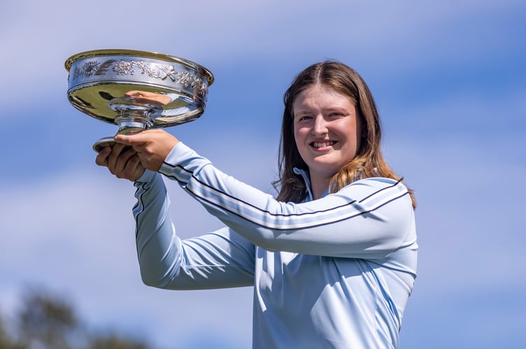 Augusta National Women's Amateur champion Lottie Woad of England lifts the Augusta National Women's Amateur Trophy during the Trophy Presentation Ceremony after winning the Augusta National Women's Amateur at Augusta National Golf Club, Saturday, April 6, 2024.